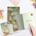 Load image into Gallery viewer, The inside of Tree-Free’s Angels and Blessings card, with the cover and envelope in the background.
