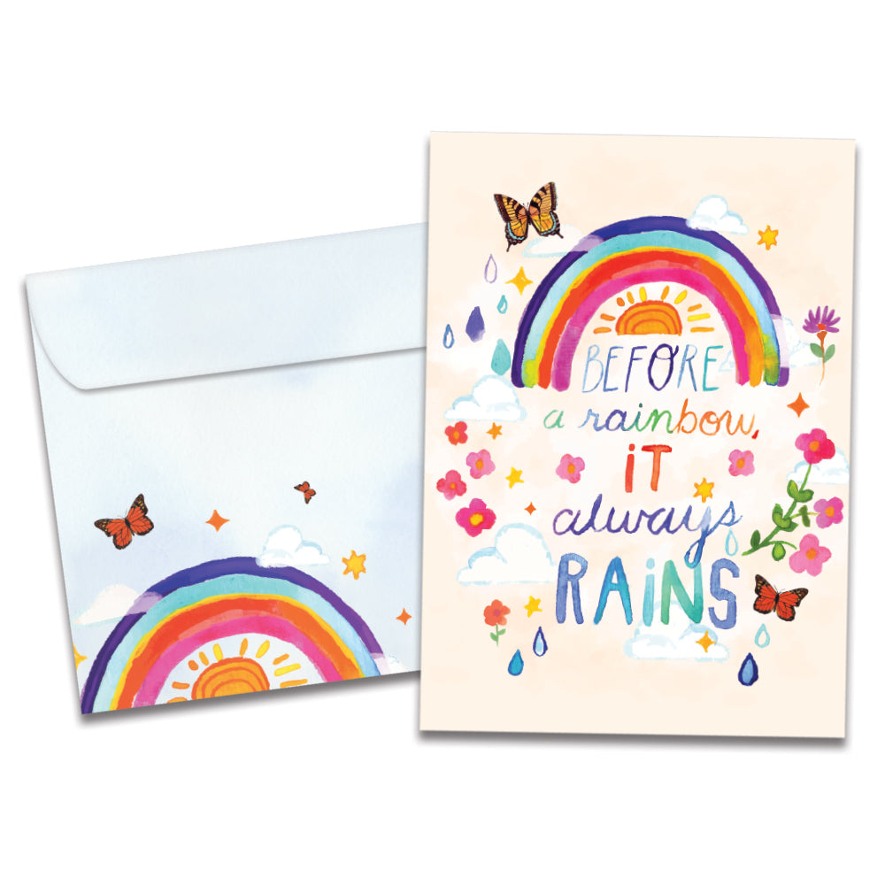 Cover of Always Rainbow Support & Encouragement card (featuring script and serif text below artwork of a rainbow and the sun surrounded by butterflies, flowers, and rain drops) and its matching envelope