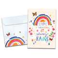 Load image into Gallery viewer, Cover of Always Rainbow Support &amp; Encouragement card (featuring script and serif text below artwork of a rainbow and the sun surrounded by butterflies, flowers, and rain drops) and its matching envelope
