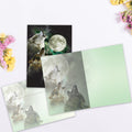 Load image into Gallery viewer, The inside of Tree-Free’s Three Wolf Moon All Occasion Card card, with the cover and envelope in the background.
