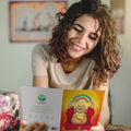 Load image into Gallery viewer, Lifestyle image(s) featuring Tree-Free’s Laughing Buddha card
