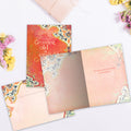 Load image into Gallery viewer, The inside of Tree-Free’s Growing Up Is Inevitable card, with the cover and envelope in the background.
