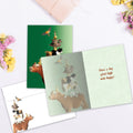 Load image into Gallery viewer, The inside of Tree-Free’s Piled High card, with the cover and envelope in the background.

