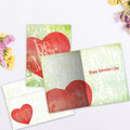 Load image into Gallery viewer, The inside of Tree-Free’s Be Mine card, with the cover and envelope in the background.
