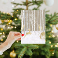 Load image into Gallery viewer, Lifestyle image(s) featuring Tree-Free’s Silent Wood Holiday Card card
