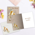 Load image into Gallery viewer, The inside of Tree-Free’s Baby Booties card, with the cover and envelope in the background.
