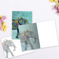 Load image into Gallery viewer, The inside of Tree-Free’s Elephant And Yellowbirds card, with the cover and envelope in the background.
