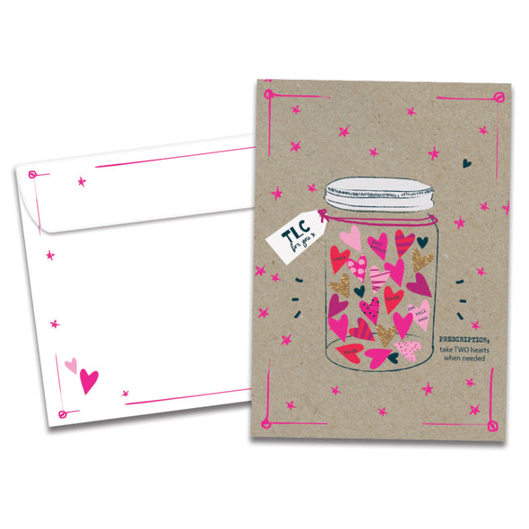 Cover of TLC RX Get Well card (featuring serif text next to artwork of a prescription bottle filled with hearts and surrounded by stars) and its matching envelope