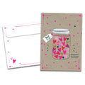 Load image into Gallery viewer, Cover of TLC RX Get Well card (featuring serif text next to artwork of a prescription bottle filled with hearts and surrounded by stars) and its matching envelope
