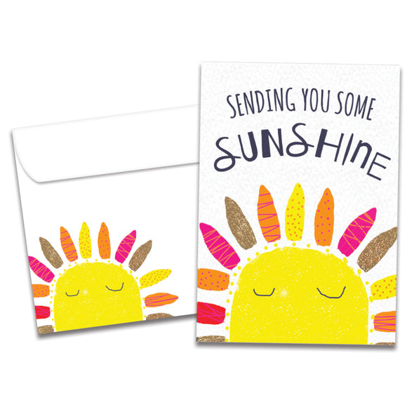Cover of Sending Sunshine All Occasion card (featuring script and serif text above artwork of the sun) and its matching envelope