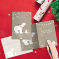 Load image into Gallery viewer, The inside of Tree-Free’s Sweet Polar Christmas Christmas Card card, with the cover and envelope in the background.
