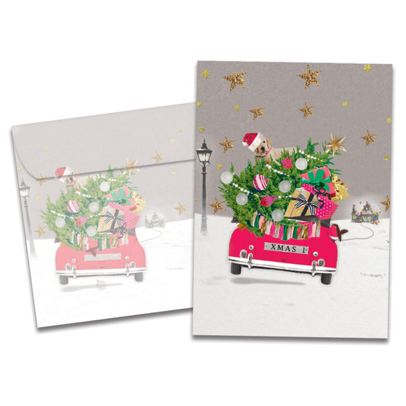 The cover of Tree-Free's Headed Home Christmas Card card, along with its matching envelope.