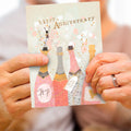 Load image into Gallery viewer, Lifestyle image(s) featuring Tree-Free’s Champagne Wishes card
