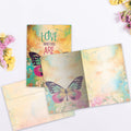 Load image into Gallery viewer, The inside of Tree-Free’s Who You Are card, with the cover and envelope in the background.
