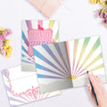 Load image into Gallery viewer, The inside of Tree-Free’s Rainbow Ninja card, with the cover and envelope in the background.
