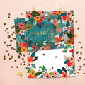 Load image into Gallery viewer, The inside of Tree-Free’s Congrats Flowers Vibrant card, with the cover and envelope in the background.
