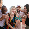 Load image into Gallery viewer, Lifestyle image(s) featuring Tree-Free’s Congrats Flowers Vibrant card
