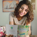 Load image into Gallery viewer, Lifestyle image(s) featuring Tree-Free’s True to Yourself Narwhal card
