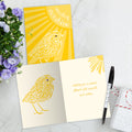 Load image into Gallery viewer, The inside of Tree-Free’s Sunshine Season card, with the cover and envelope in the background.
