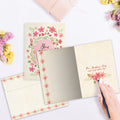 Load image into Gallery viewer, The inside of Tree-Free’s You Are Loved card, with the cover and envelope in the background.
