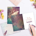 Load image into Gallery viewer, The inside of Tree-Free’s Shoot for the Stars card, with the cover and envelope in the background.
