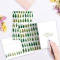 Load image into Gallery viewer, The inside of Tree-Free’s Sympathy Trees card, with the cover and envelope in the background.

