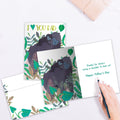 Load image into Gallery viewer, The inside of Tree-Free’s Shoulder to Lean On card, with the cover and envelope in the background.
