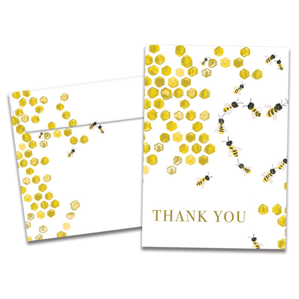 Cover of Bee Kind Thank You card (featuring serif text below artwork of bumblebees in a hive flying in a heart-shaped formation) and its matching envelope