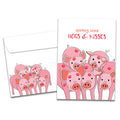 Load image into Gallery viewer, The cover of Tree-Free&#39;s Hogs and Kisses card, along with its matching envelope.
