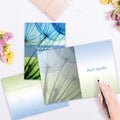 Load image into Gallery viewer, The inside of Tree-Free’s Caring Hearts card, with the cover and envelope in the background.
