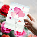 Load image into Gallery viewer, Lifestyle image(s) featuring Tree-Free’s Heart Balloons card
