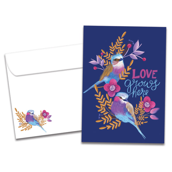The cover of Tree-Free's Love Grows Here card, along with its matching envelope.