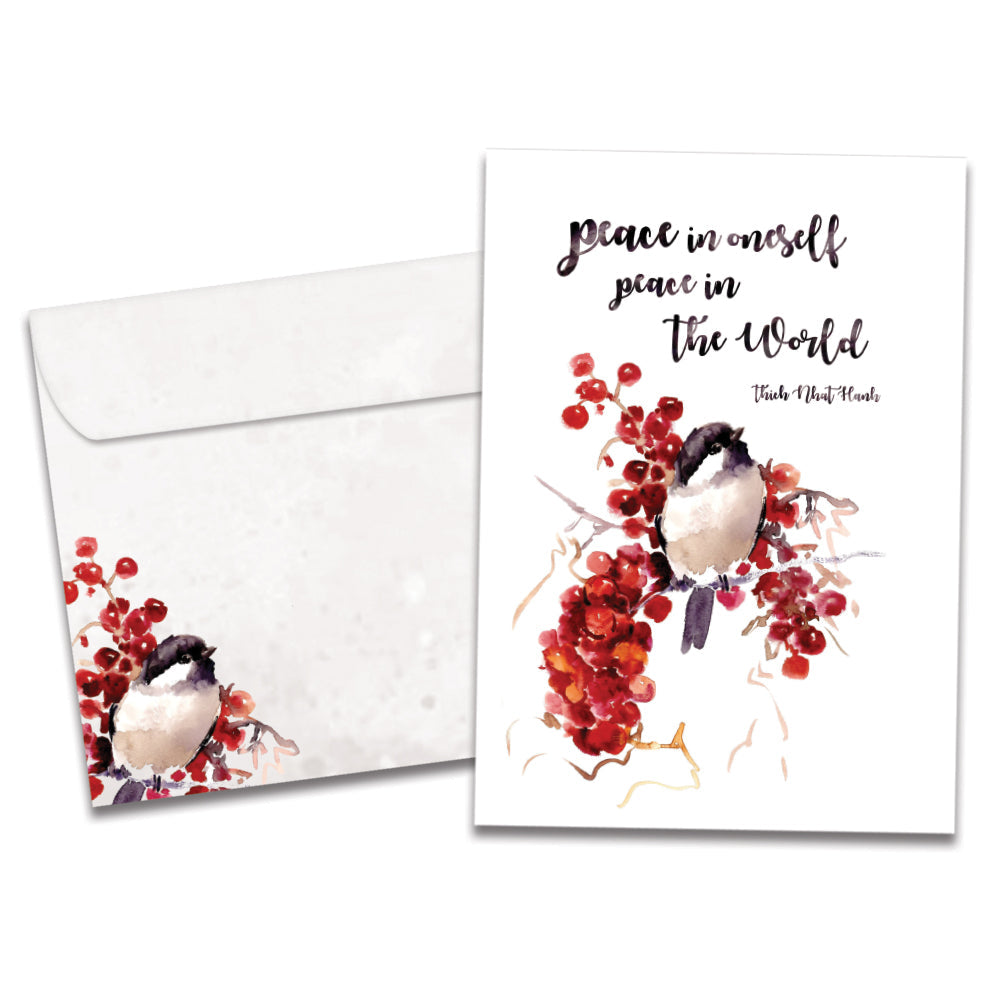 The cover of Tree-Free's Peace In The World Holiday Card card, along with its matching envelope.