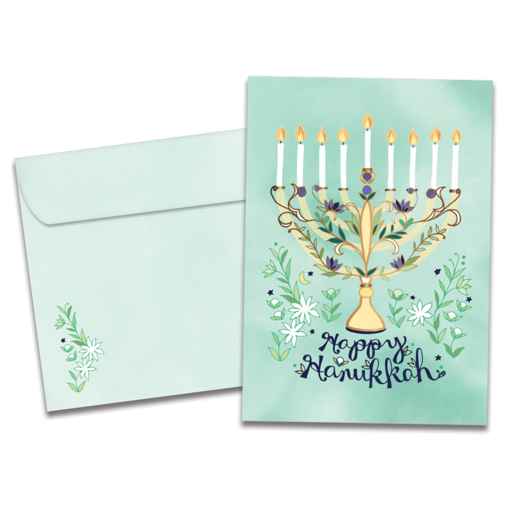 The cover of Tree-Free's Floral Menorah Hanukkah Card card, along with its matching envelope.