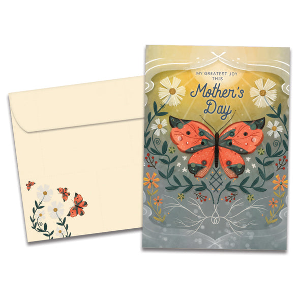 The cover of Tree-Free's Greatest Joy card, along with its matching envelope.