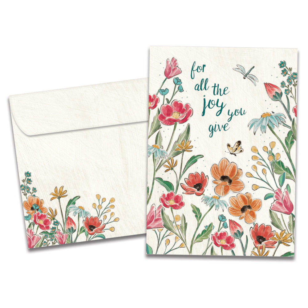 The cover of Tree-Free's Joy You Give card, along with its matching envelope.