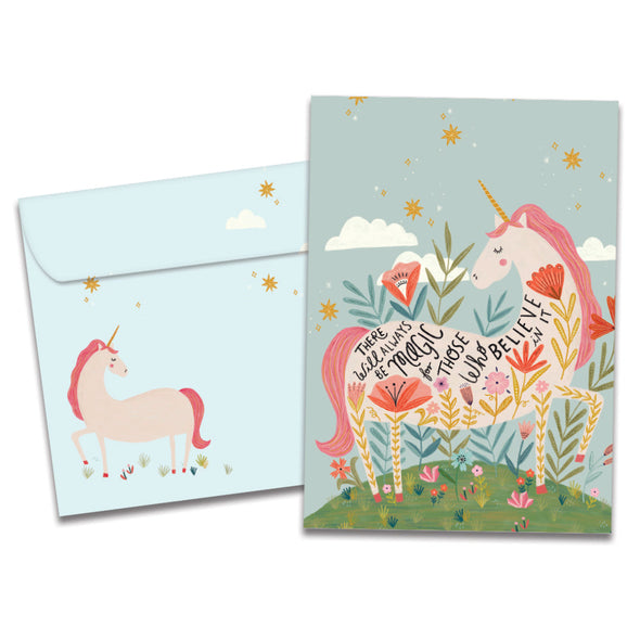 The cover of Tree-Free's Magical Floral Unicorn card, along with its matching envelope.