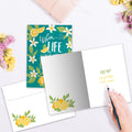 Load image into Gallery viewer, The inside of Tree-Free’s Lemon Recipes card, with the cover and envelope in the background.
