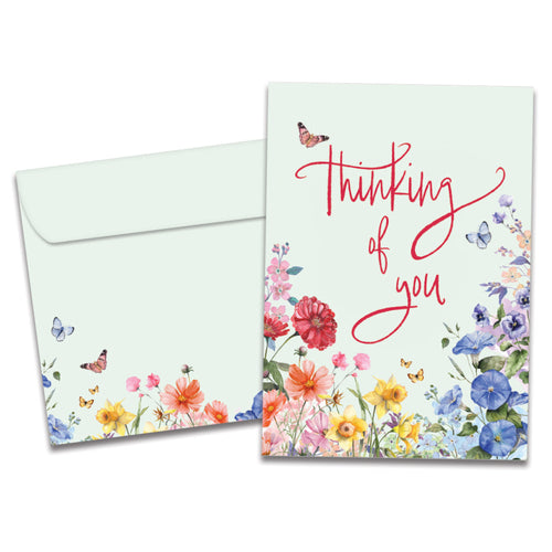 The cover of Tree-Free's Rainbow Florals card, along with its matching envelope.