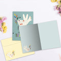 Load image into Gallery viewer, The inside of Tree-Free’s Beautiful Peace card, with the cover and envelope in the background.
