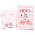 Load image into Gallery viewer, The cover of Tree-Free&#39;s Hogs and Kisses card, along with its matching envelope.
