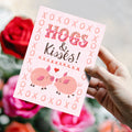 Load image into Gallery viewer, Lifestyle image(s) featuring Tree-Free’s Hogs and Kisses card
