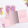 Load image into Gallery viewer, The inside of Tree-Free’s So Loved card, with the cover and envelope in the background.
