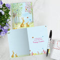 Load image into Gallery viewer, The inside of Tree-Free’s Spring Meadow card, with the cover and envelope in the background.
