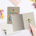 Load image into Gallery viewer, The inside of Tree-Free’s Cheerleader Cats card, with the cover and envelope in the background.
