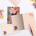 Load image into Gallery viewer, The inside of Tree-Free’s Spread Your Wings card, with the cover and envelope in the background.
