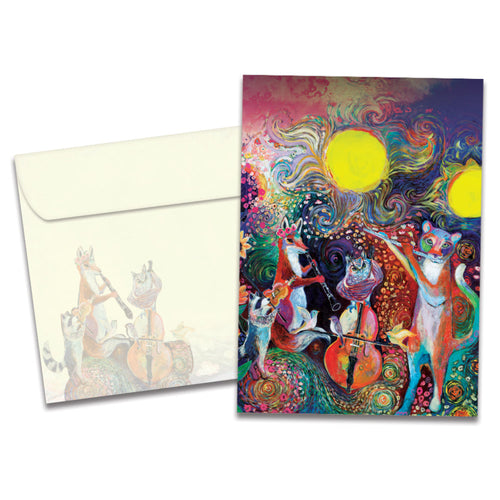 The cover of Tree-Free's Animal Serenade Birthday card, along with its matching envelope. The card cover features a group of forest animals playing musical instruments in front of a painted sunset background.