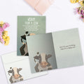 Load image into Gallery viewer, The inside of Tree-Free’s Wisdom from a Cow card, with the cover and envelope in the background.
