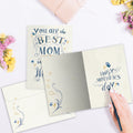 Load image into Gallery viewer, The inside of Tree-Free’s Best in the World card, with the cover and envelope in the background.
