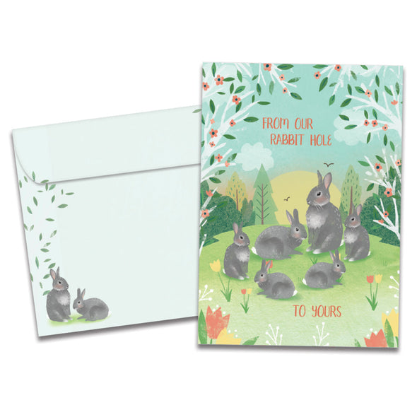 The cover of Tree-Free's Bunny Family Wishes card, along with its matching envelope.